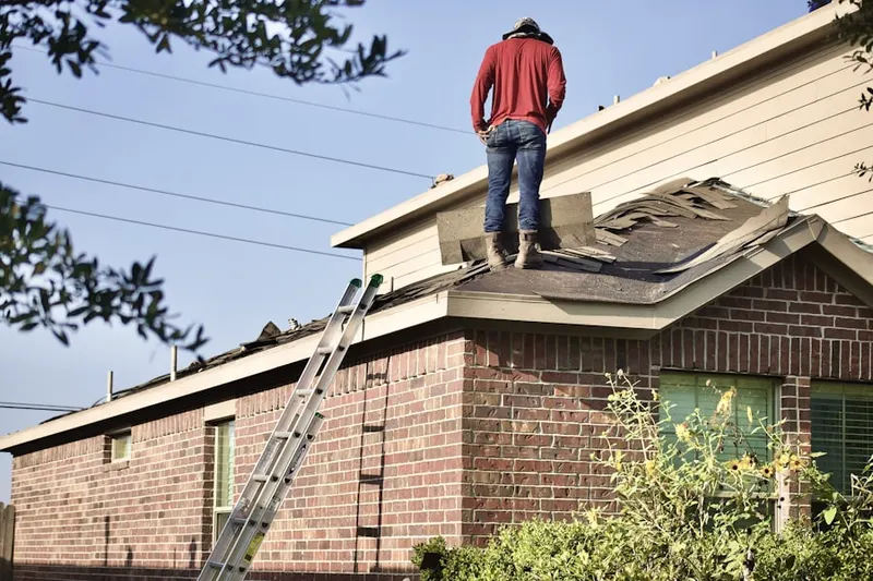 Professional roofer working on a residential roof in Kempfield
